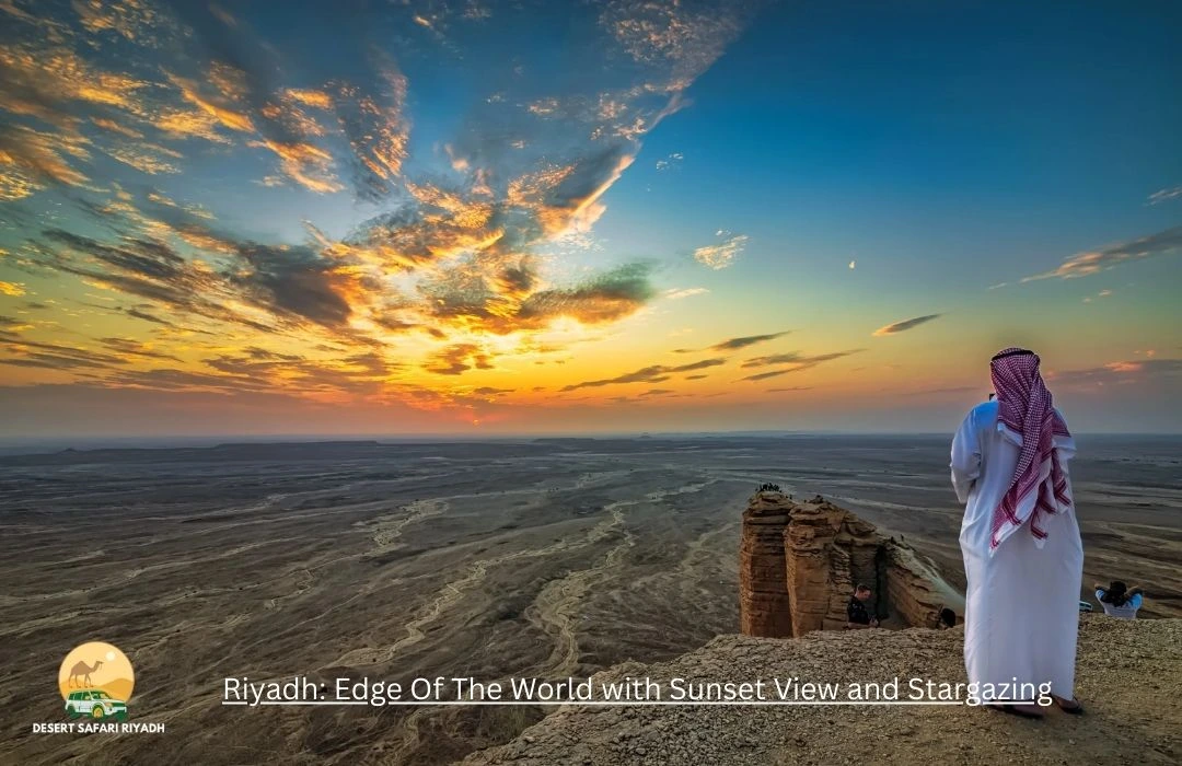 Edge of the World in Riyadh during sunset with glowing sky and stars appearing above desert cliffs.