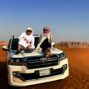 Family enjoying a Family-Friendly Desert Safari in Riyadh with kids riding camels and exploring sand dunes safely.
