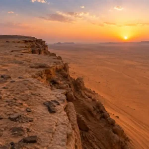 "Top Tips for Planning Your Riyadh Edge – panoramic desert cliffs with golden dunes and scenic viewpoints under a clear sky"