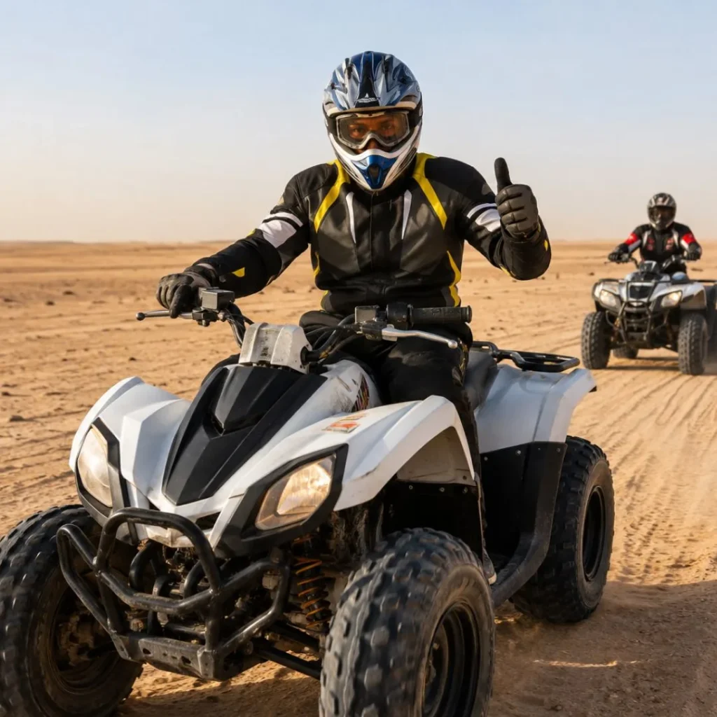 "Why Quad Biking in Riyadh Is a Must Try for Adventure Lovers – tourists riding quad bikes across golden desert dunes with natural sunlight"
