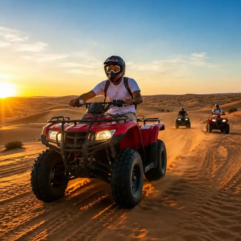 Is Quad Biking Riyadh Across Golden Dunes – tourists riding ATVs over golden desert dunes under natural sunlight for an adventurous desert experience